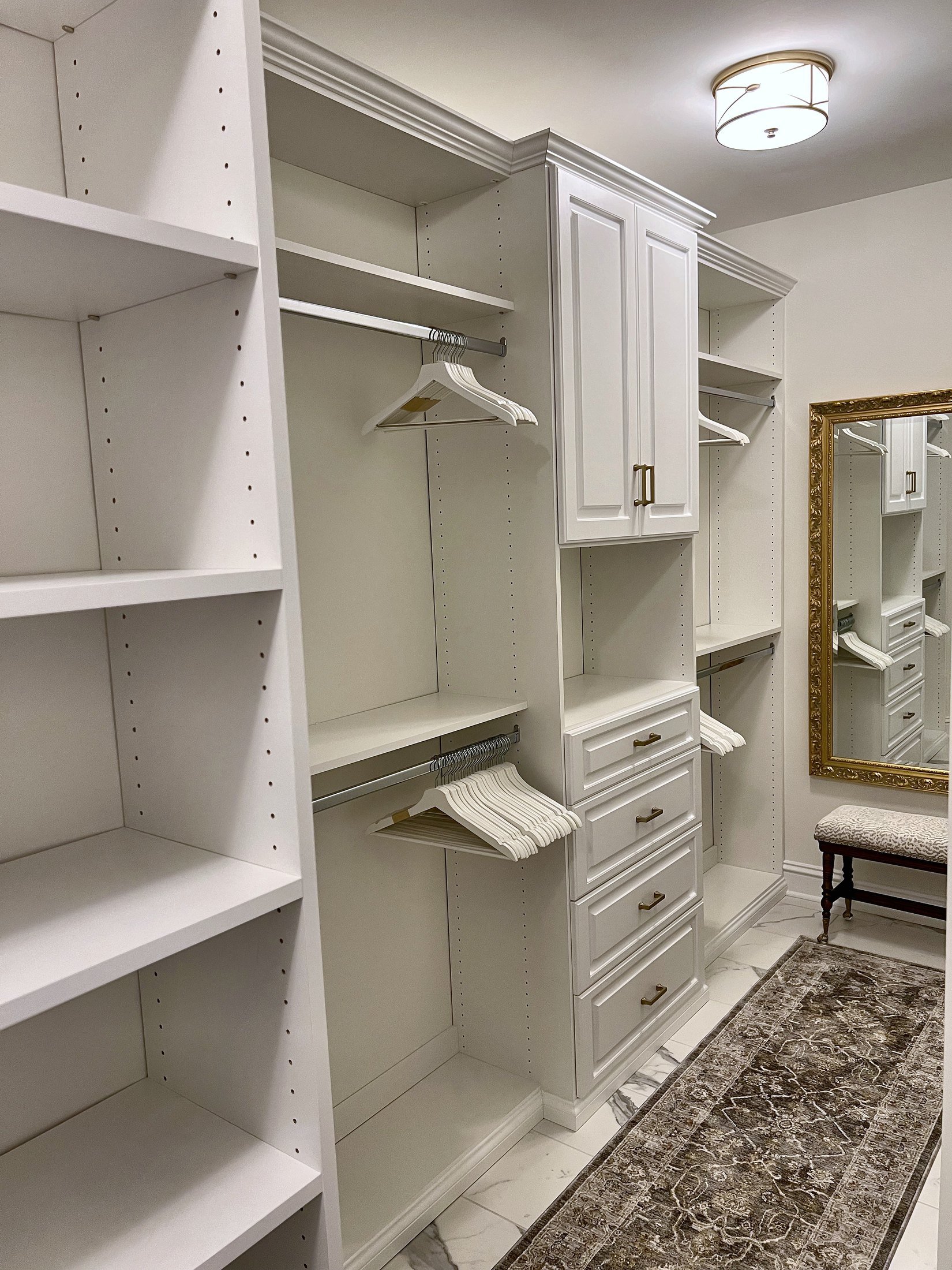 Custom walk-in closet with shelving and drawers