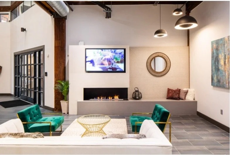 Lobby lounge with a fireplace wall