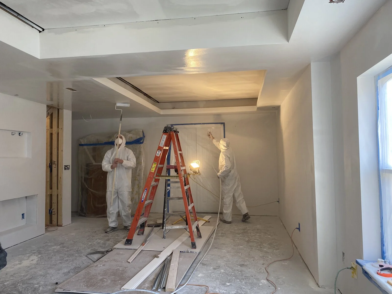 During: priming the walls and ceilings
