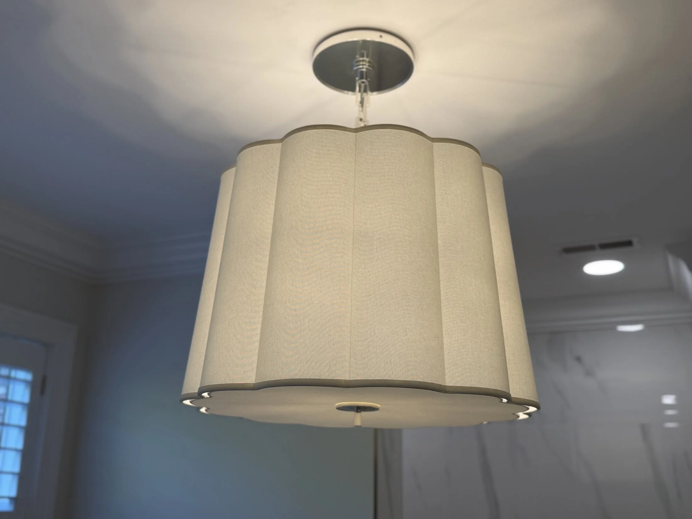 Drum pendant light with a fabric shade