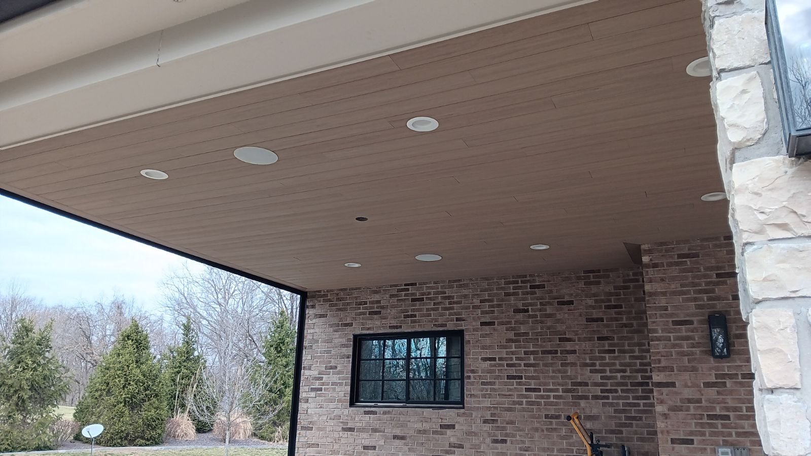 Tongue-and-groove patio ceiling with recessed lights