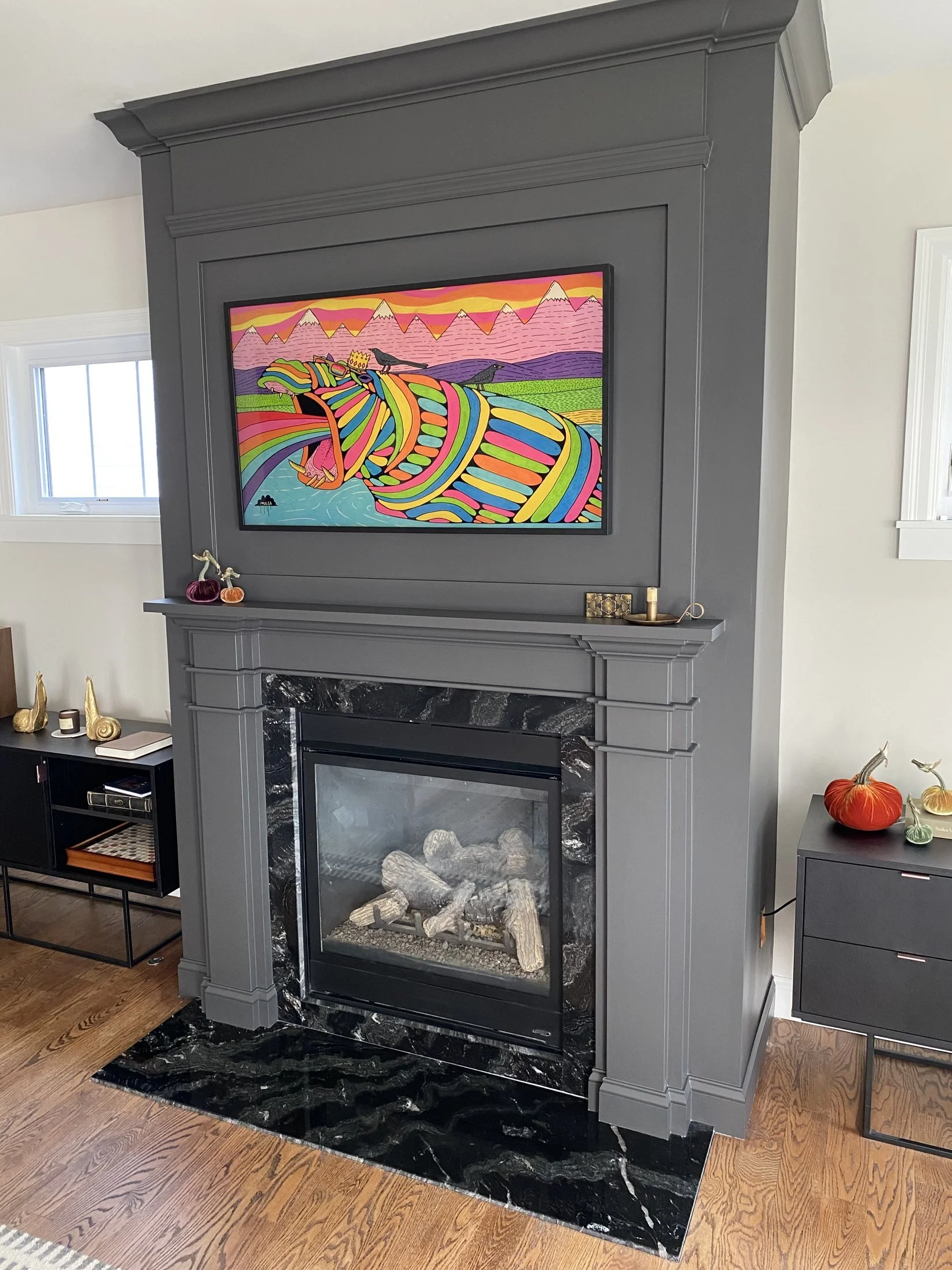 Custom overmantel framing a wall-mounted TV