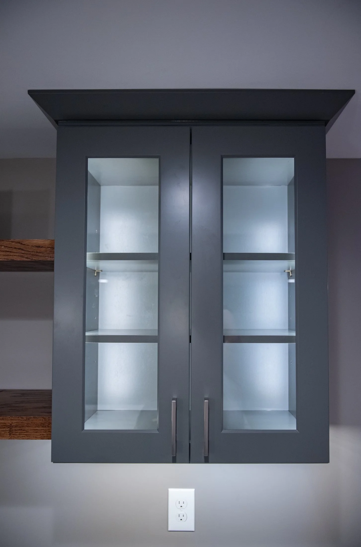 Glass-front cabinet with lighting