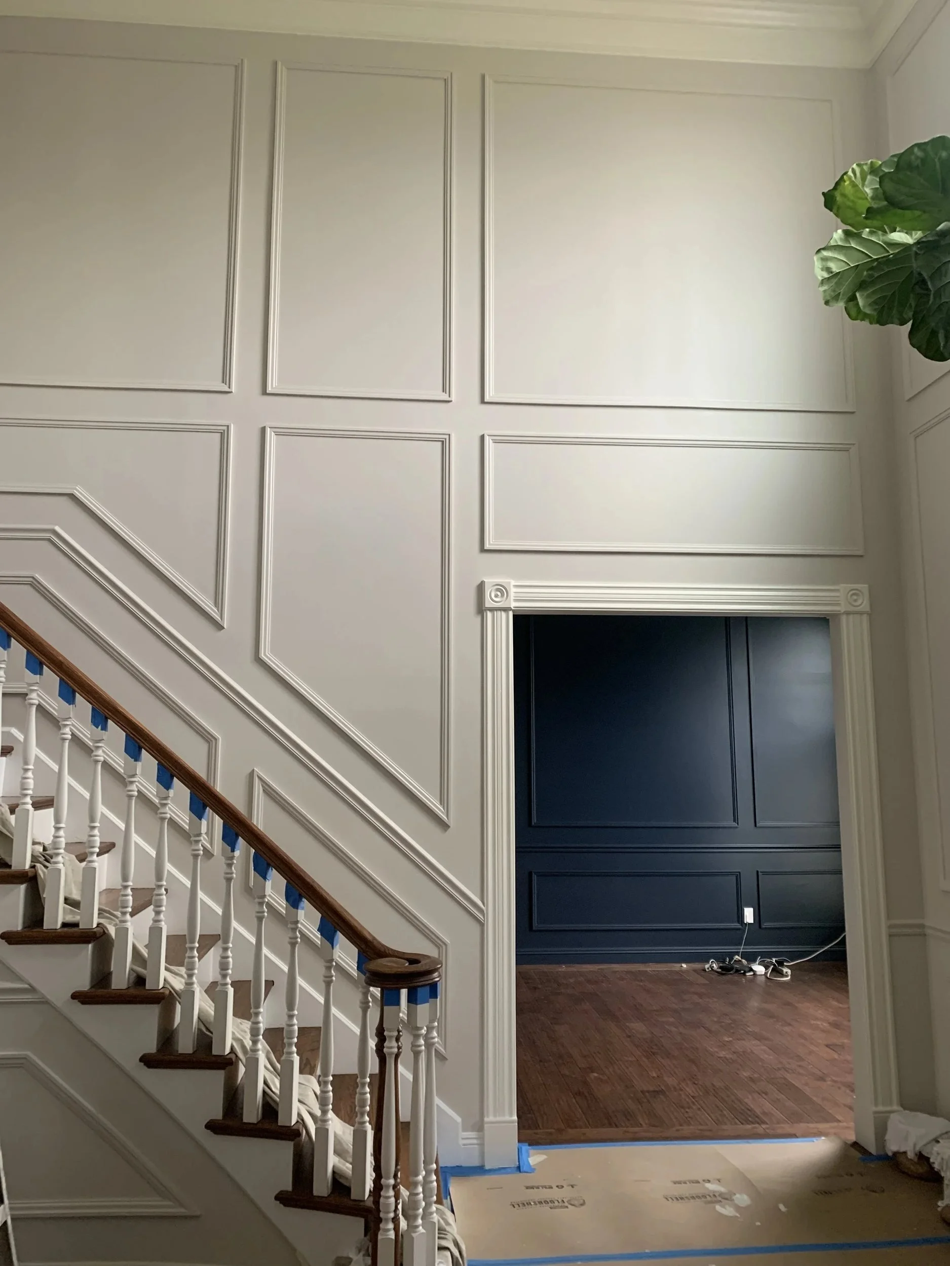 Two-story wall panel moldings before paint