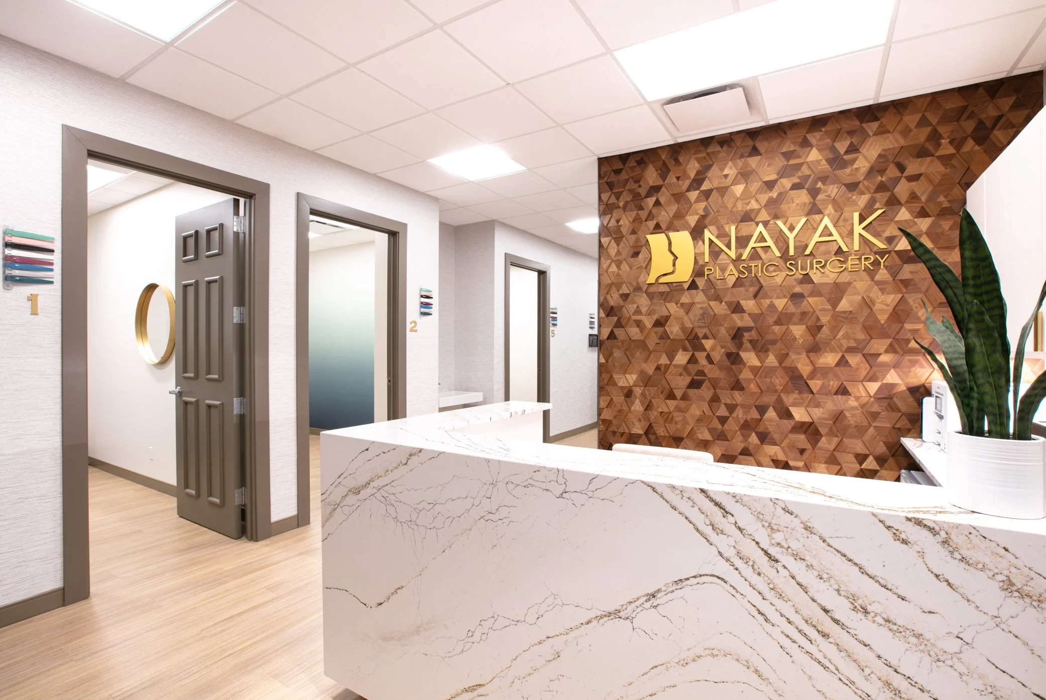 Quartz reception desk with a wood feature wall