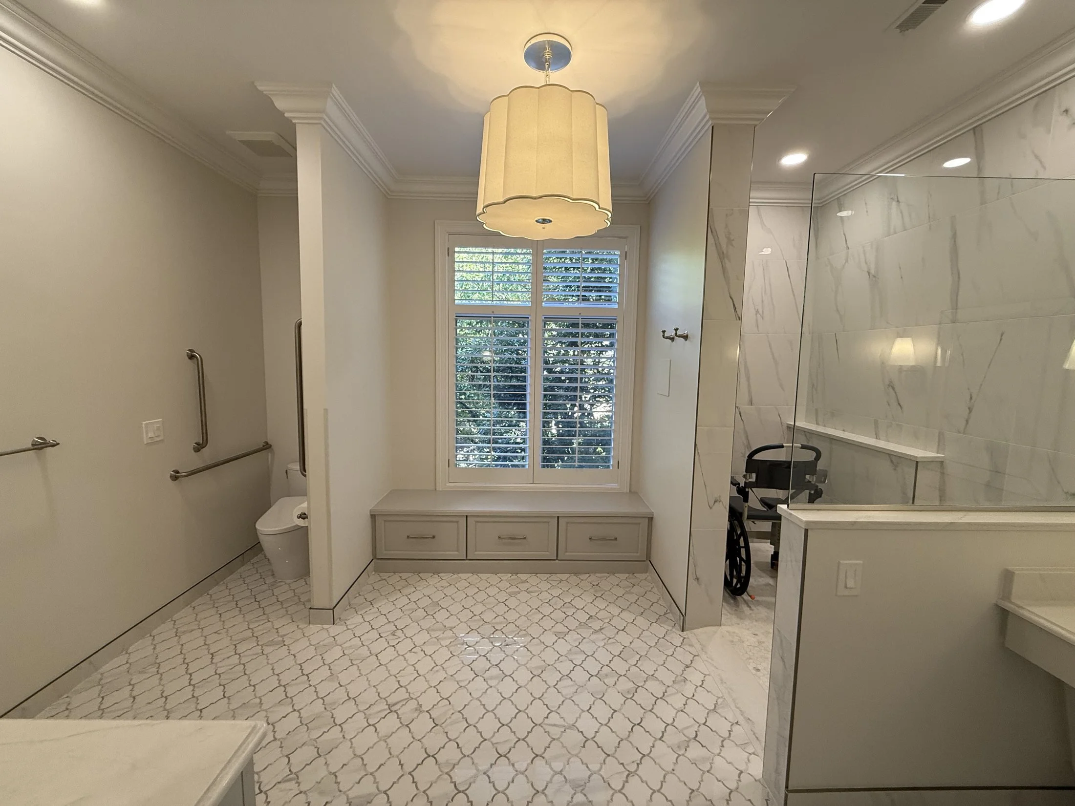 Primary bath with a window seat and drum pendant