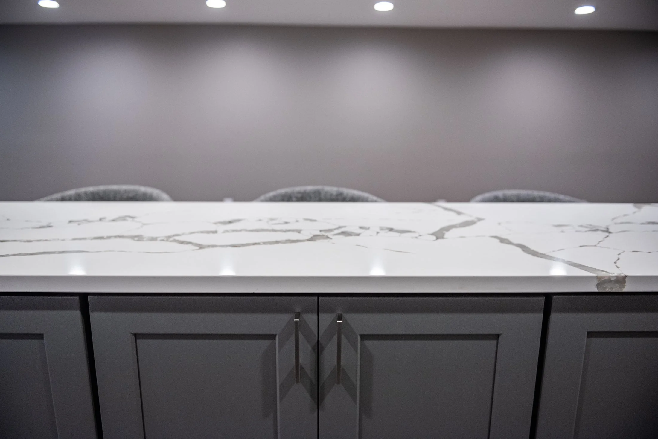 Quartz countertop over gray shaker cabinets