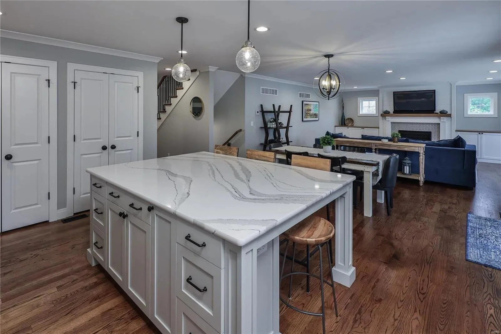 Kitchen island with seating and open living area