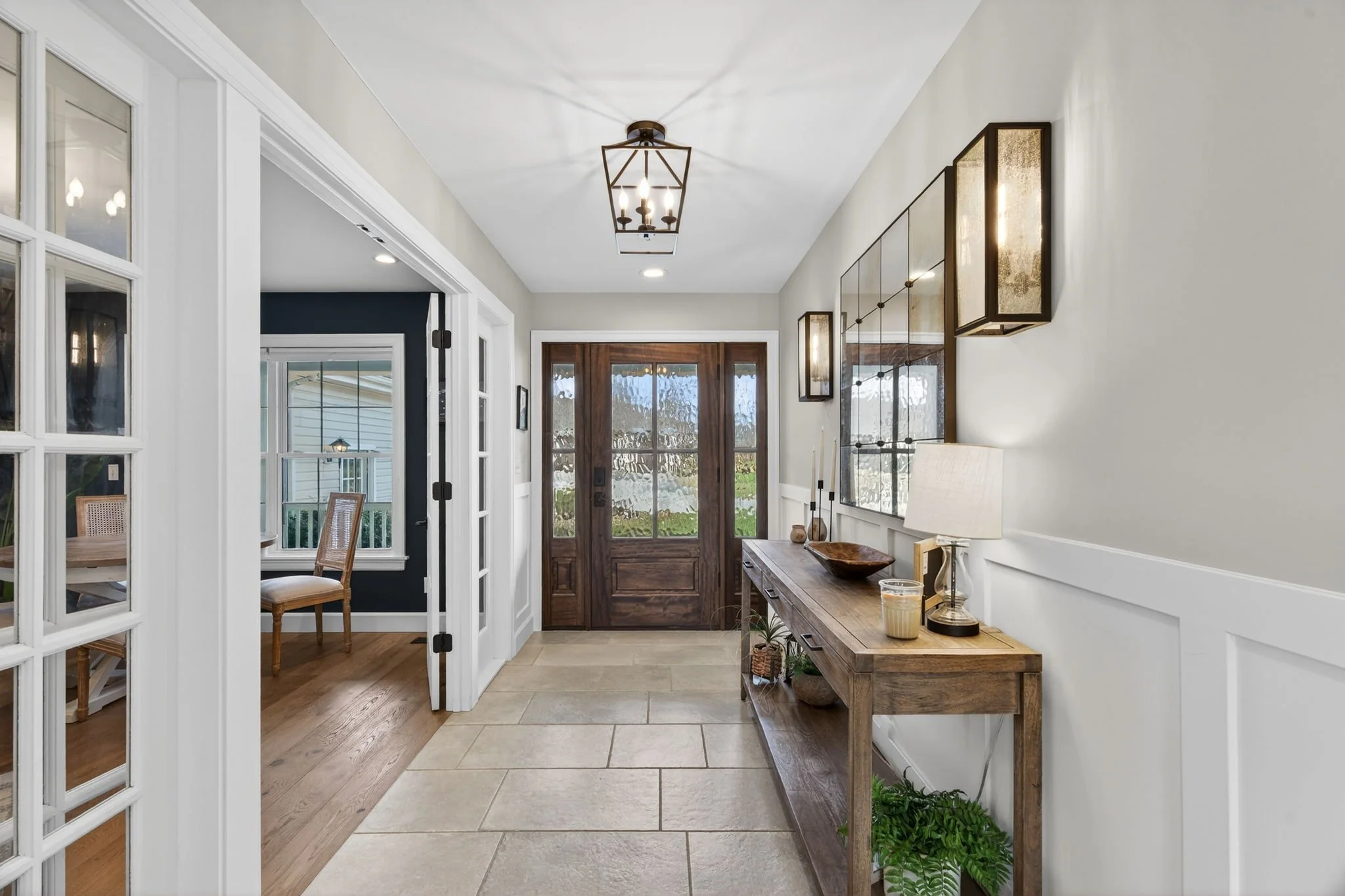 Front entry hall with wainscoting and lantern lighting