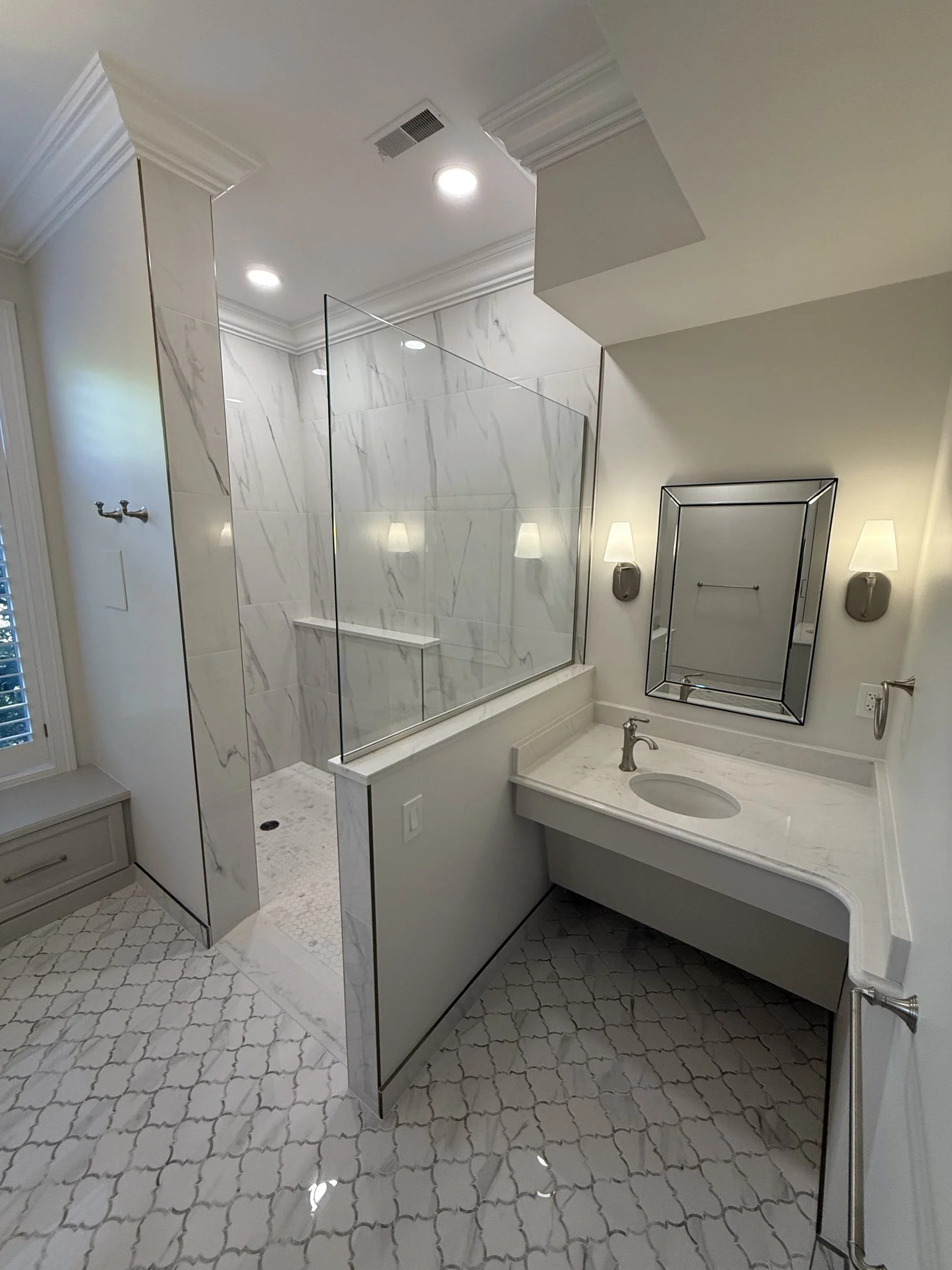 Walk-in shower with a vanity beyond