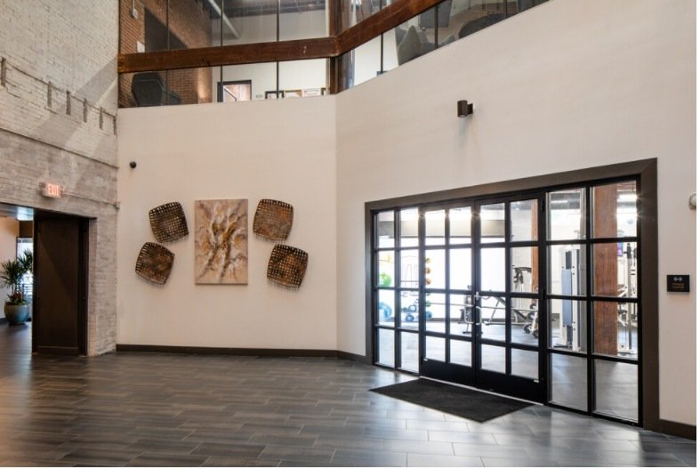 Entry with black steel-framed glass doors