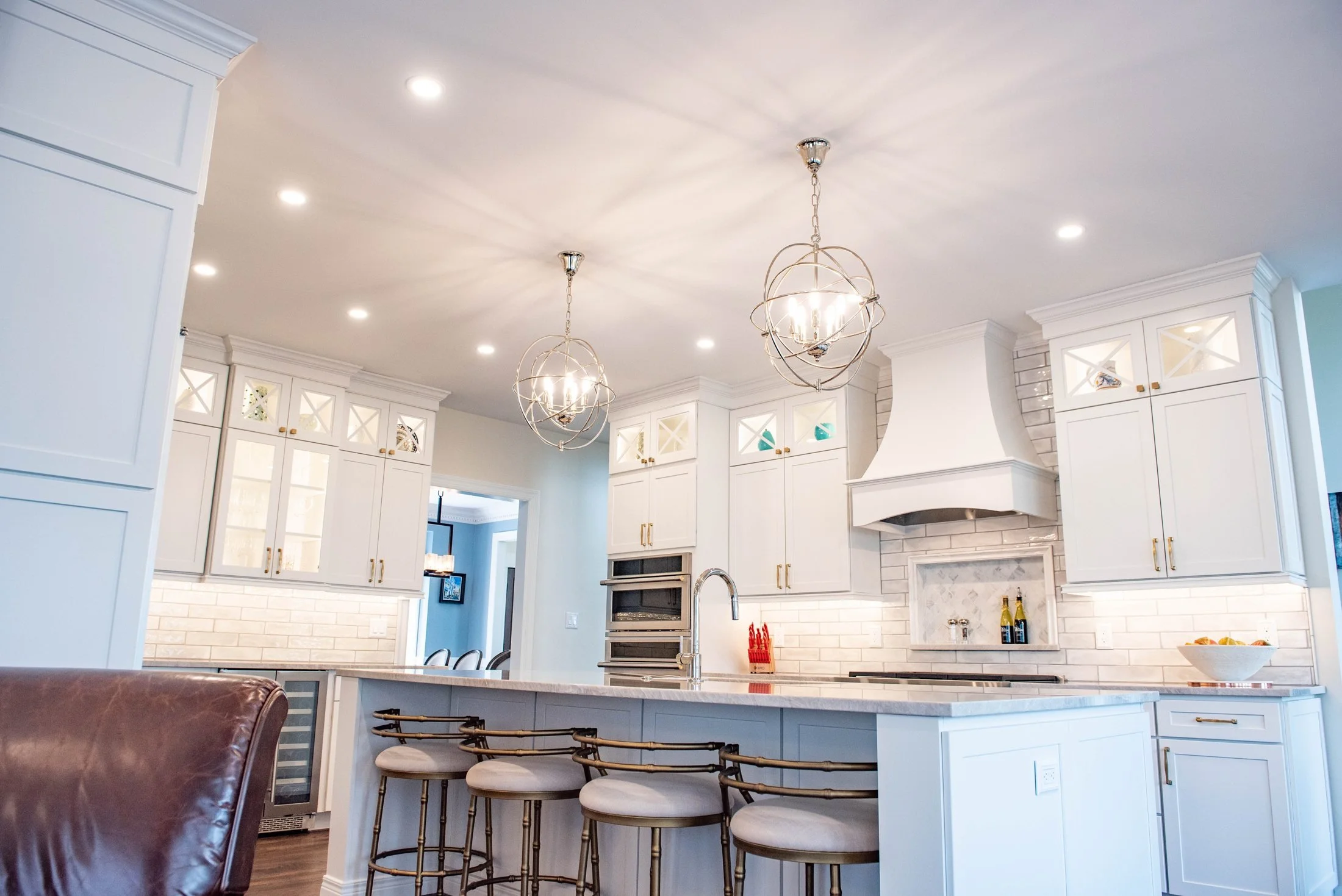 Kitchen island with seating and white cabinetry