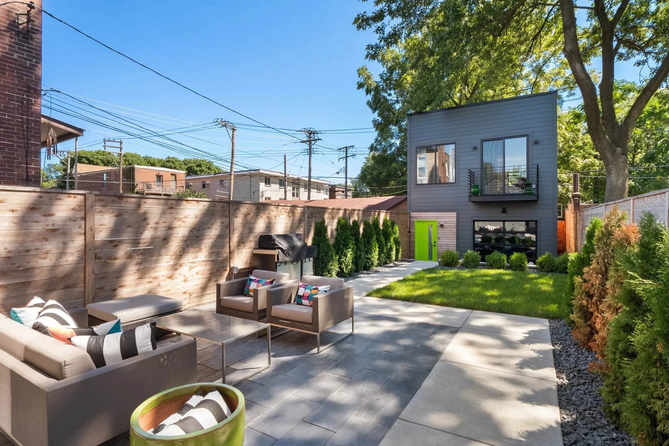 Courtyard patio with outdoor seating and lawn