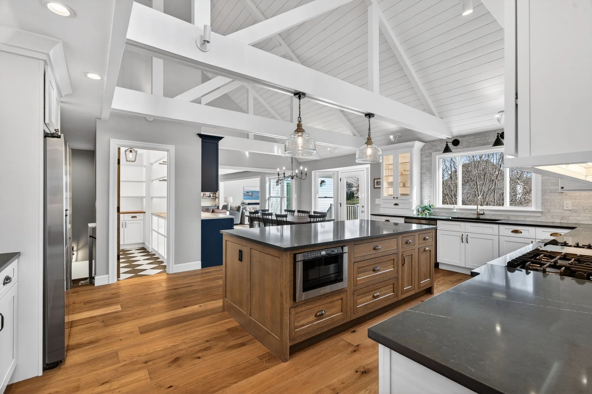 Kitchen with a wood island and dark countertops