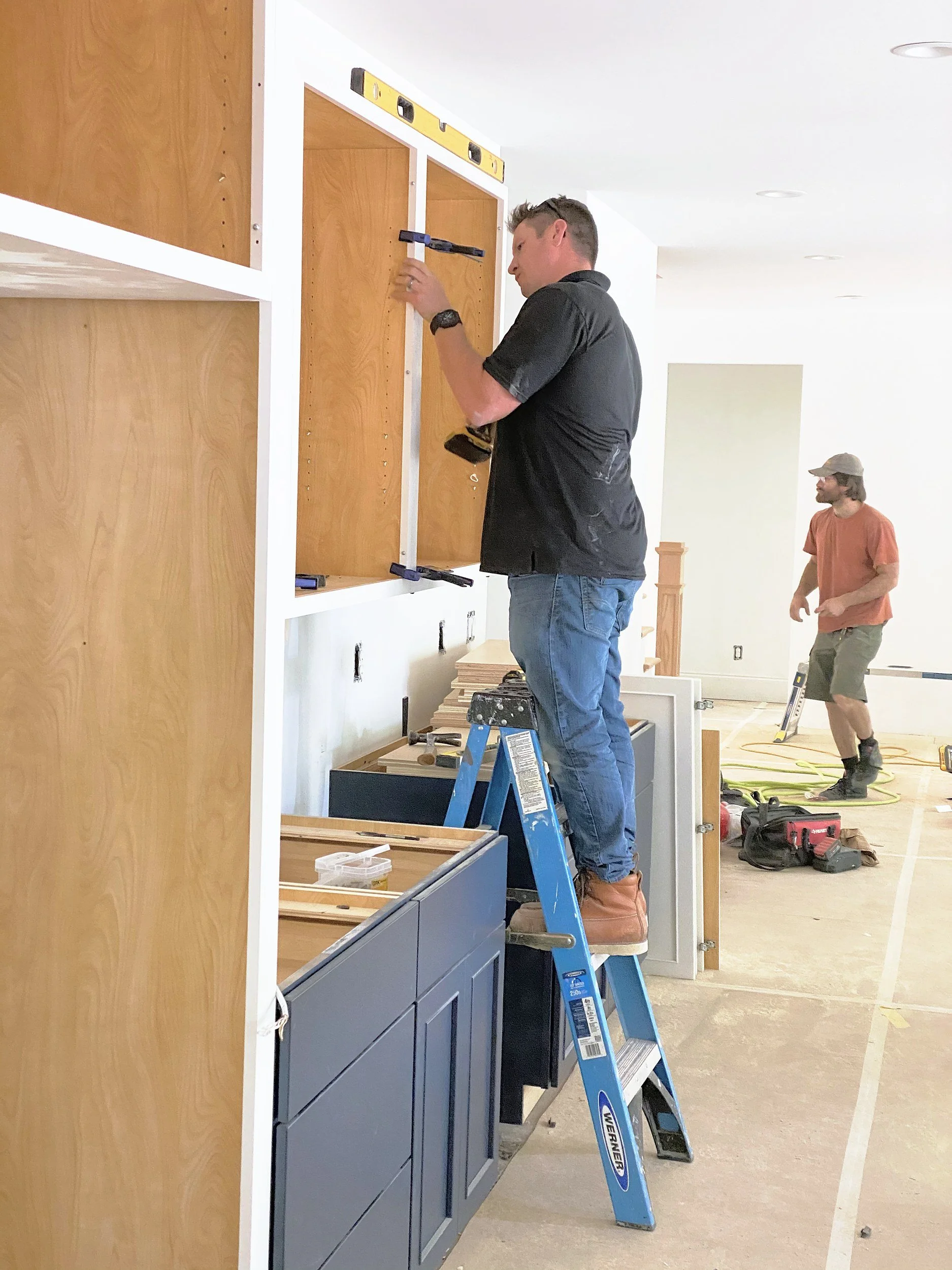 Our crew hanging upper cabinets