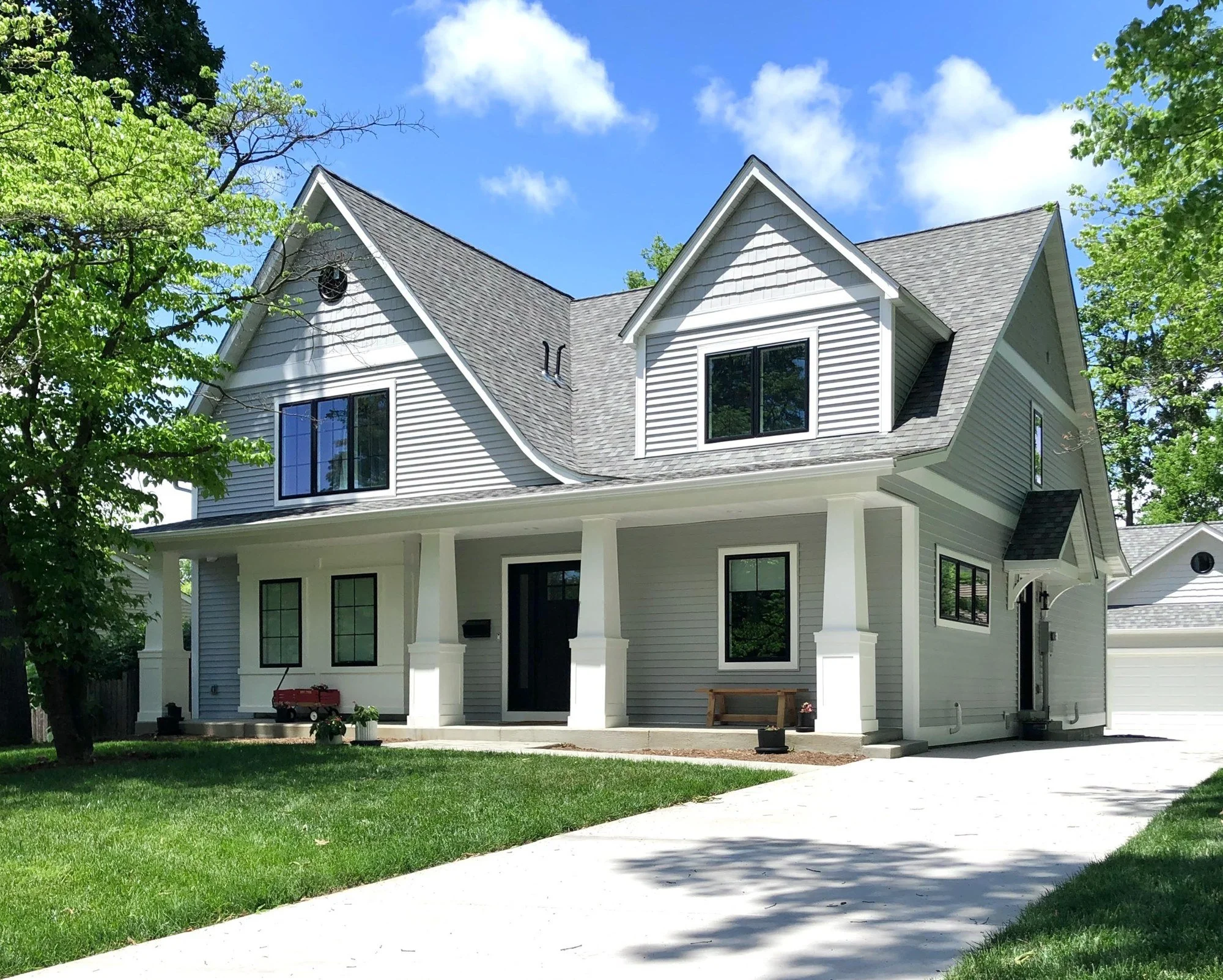 Custom craftsman home with a full front porch and tapered columns