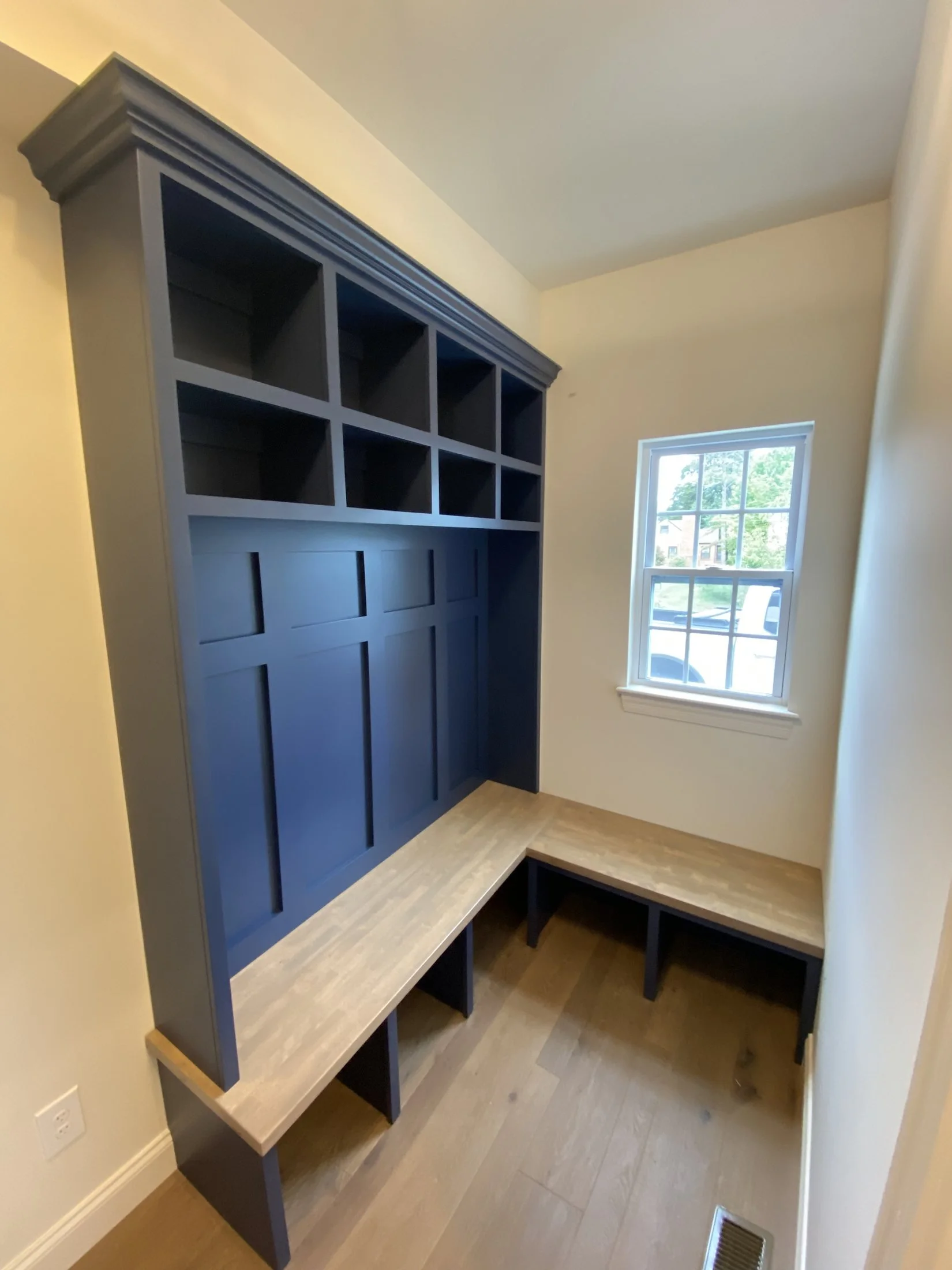 Corner mudroom built-in with cubbies