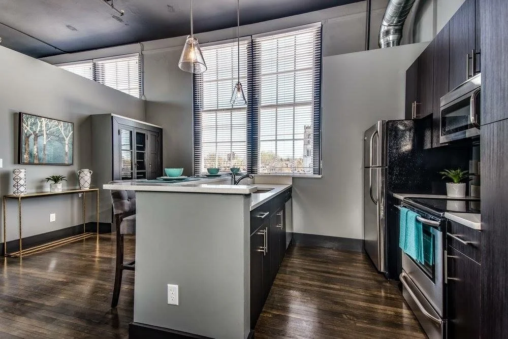 Galley-style loft kitchen with an island