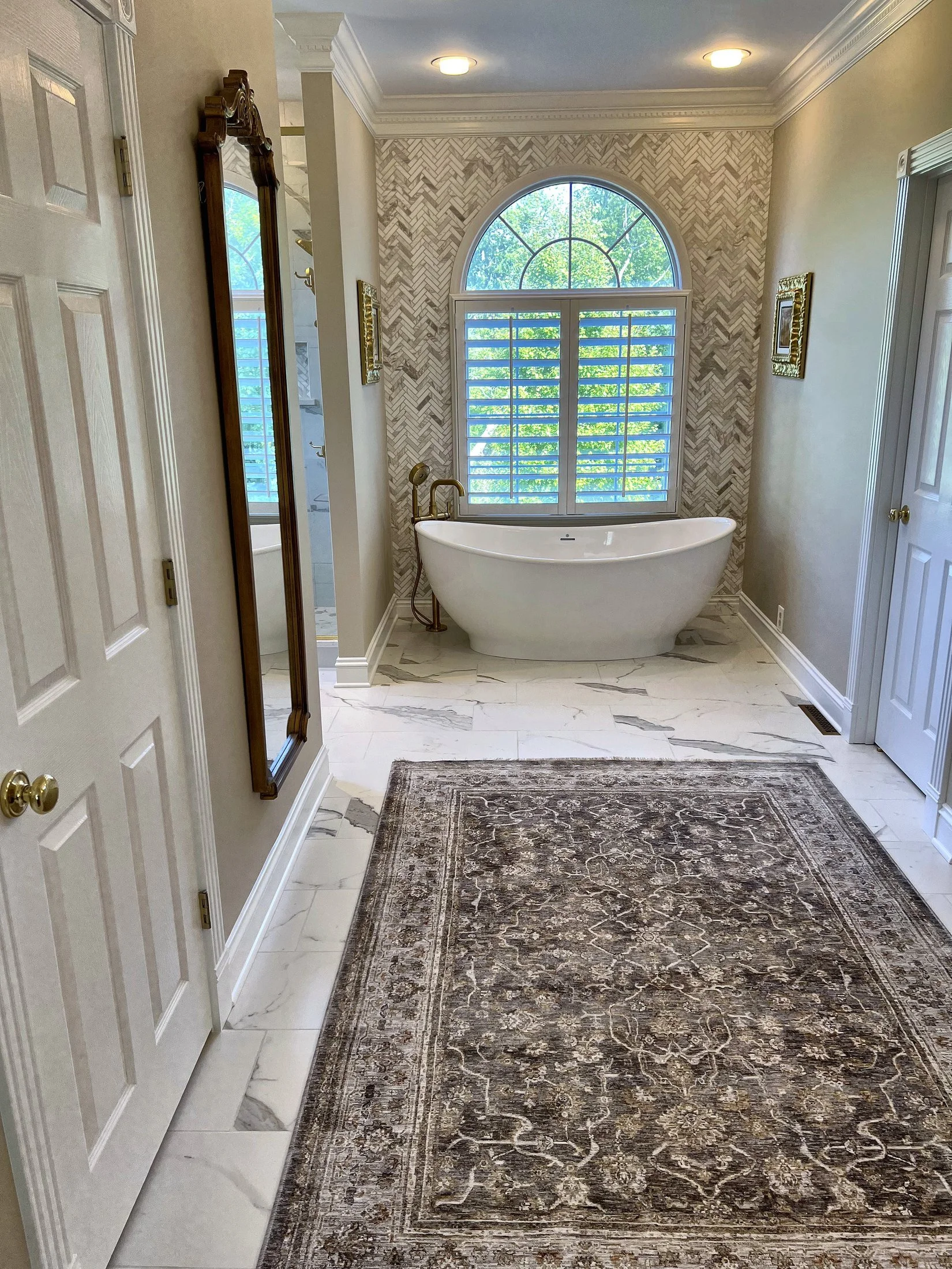 View down the bathroom to the freestanding tub