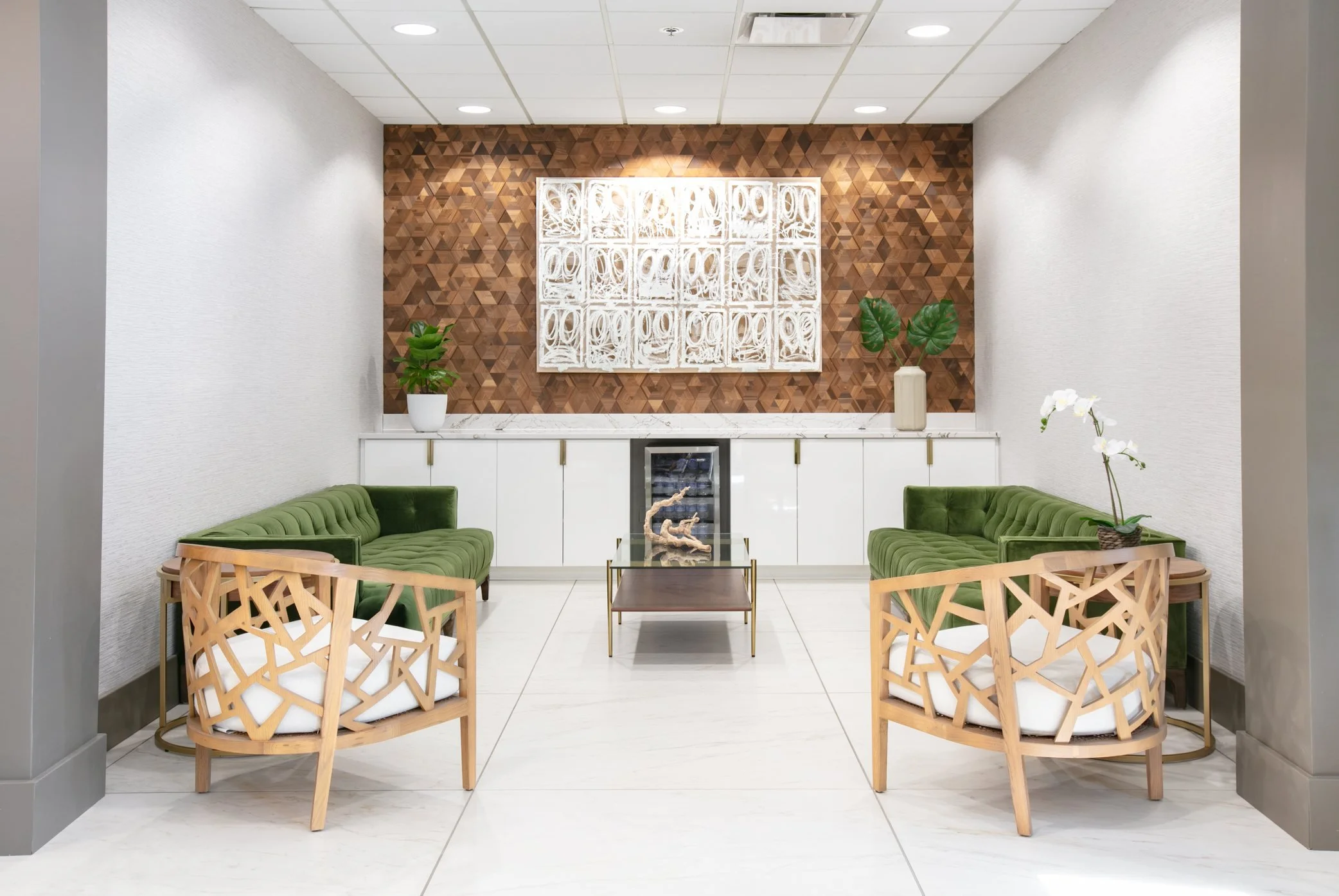 Seating area in front of a geometric wood wall
