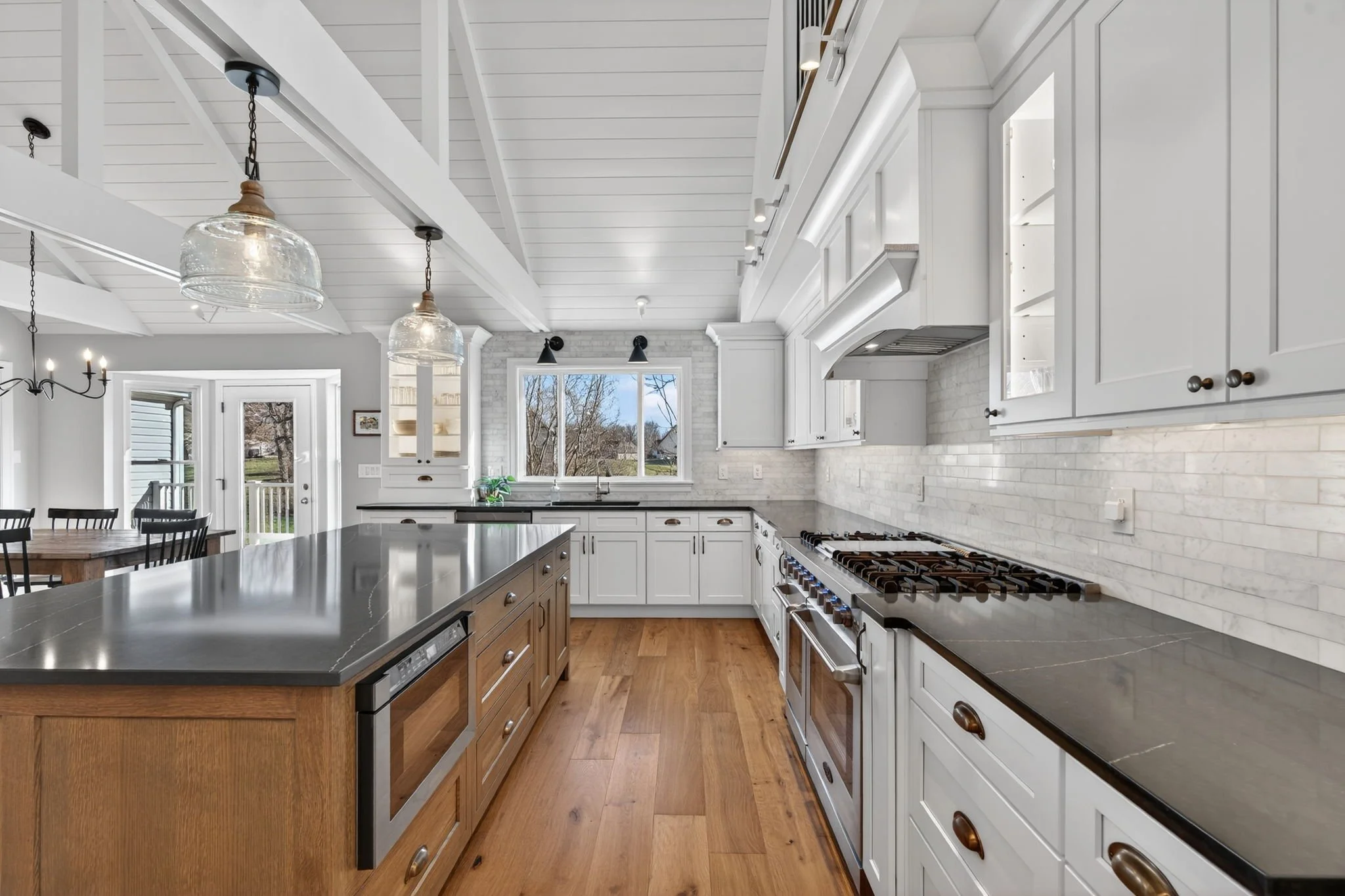 Wood island with a microwave drawer and a professional range