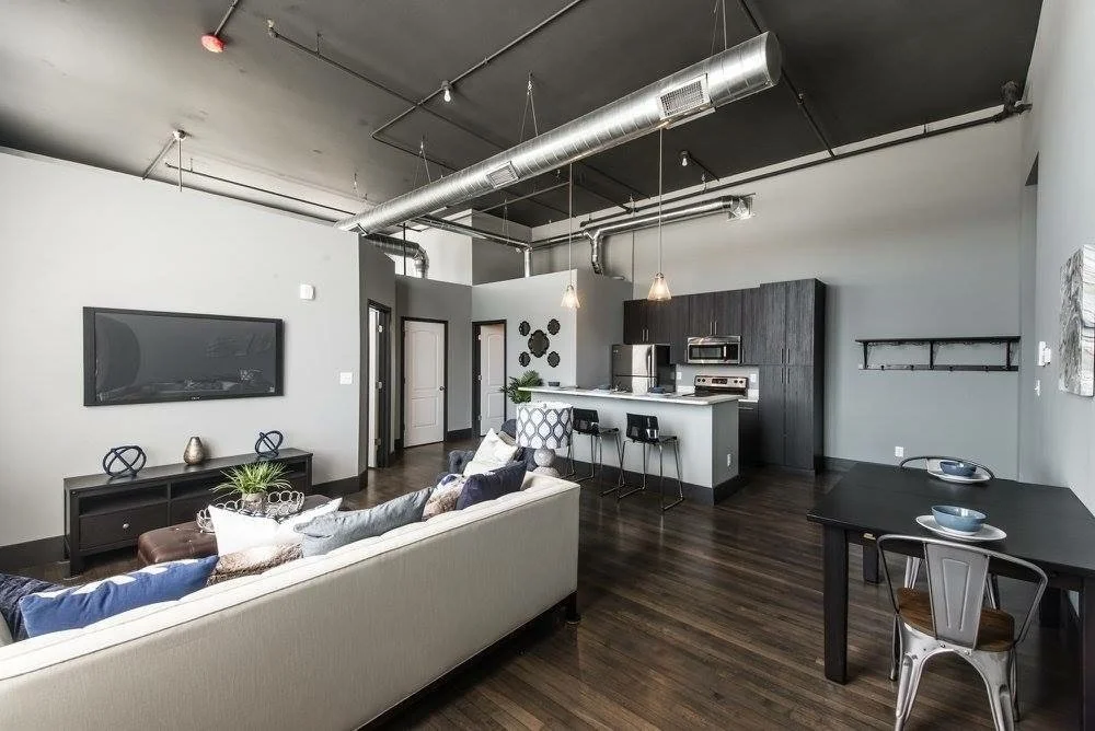 Open loft living area with exposed ductwork
