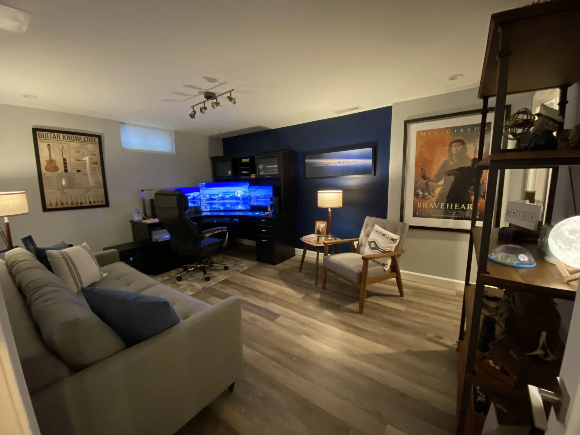 Basement office and media area with wood-look flooring