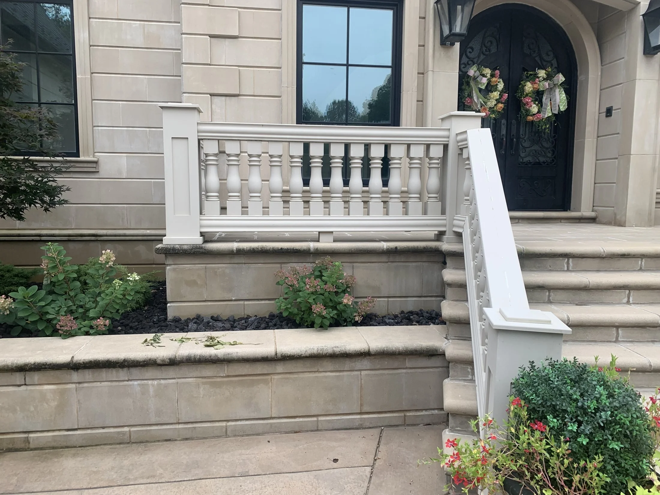 Front entry steps with a painted balustrade