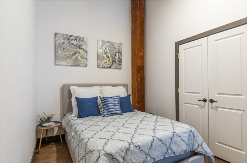 Loft bedroom with a timber column