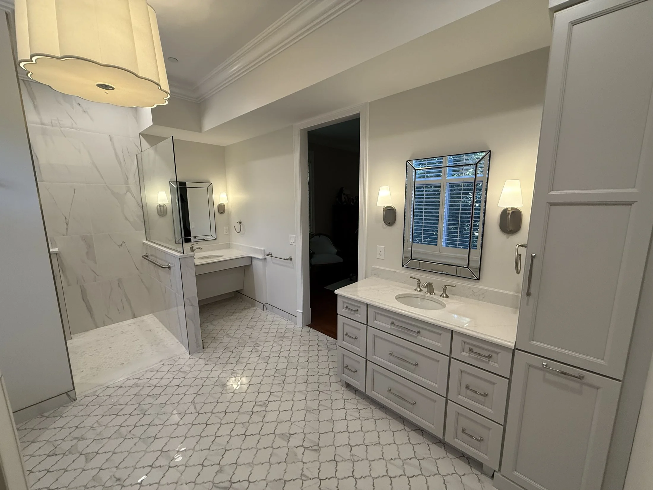 Long double vanity with framed mirrors and sconces