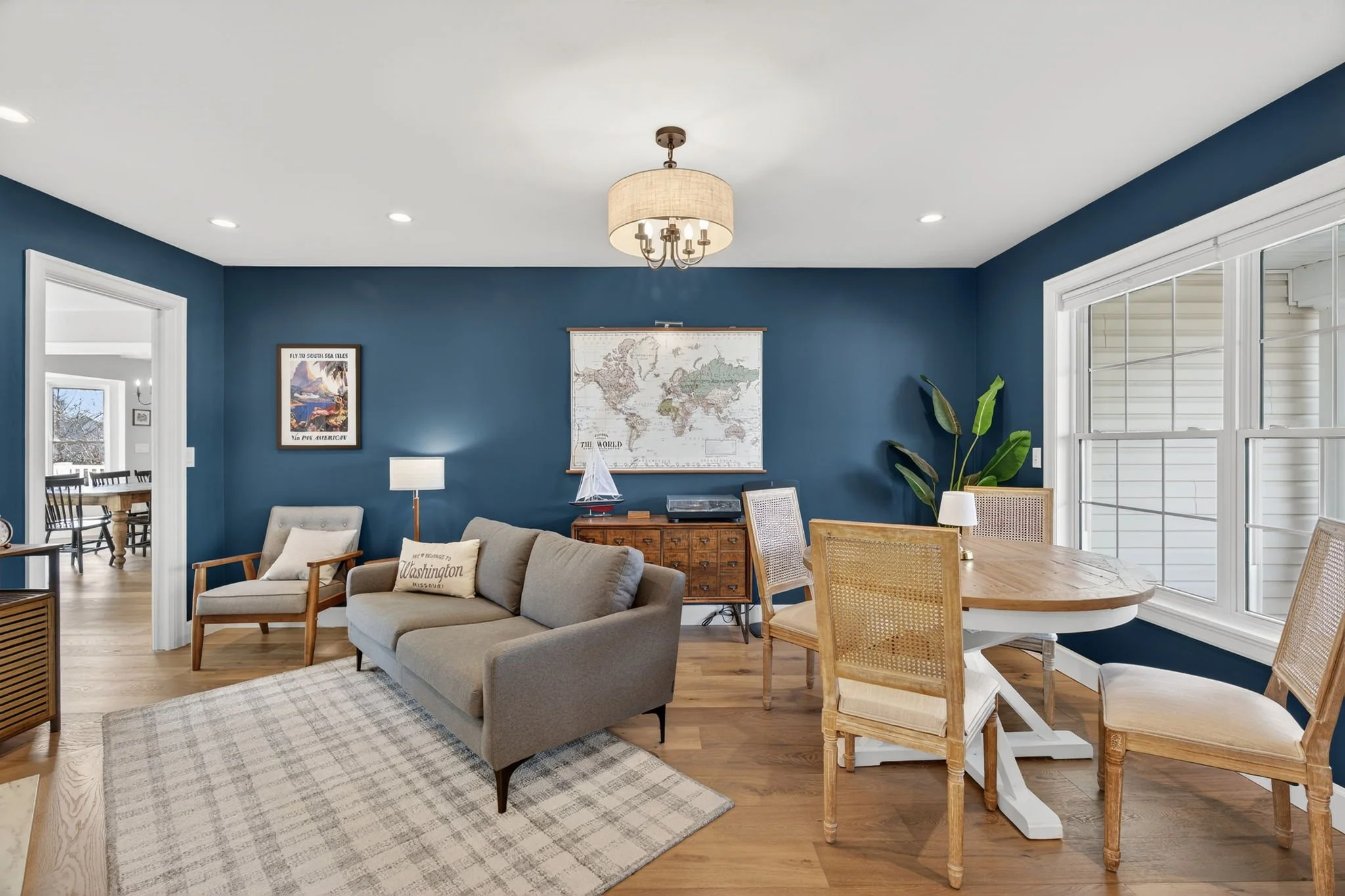 Navy sitting room with a reading area