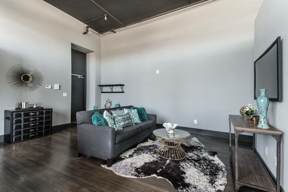 Loft living area with dark wood floors
