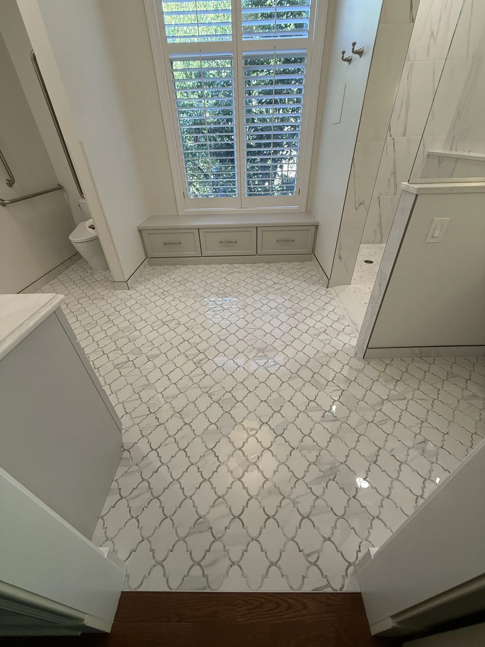 Arabesque mosaic tile floor and window seat