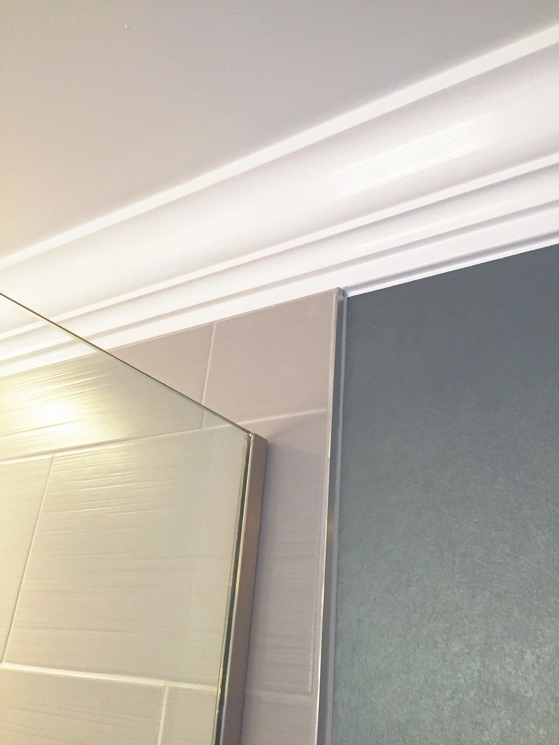 Crown molding over navy walls