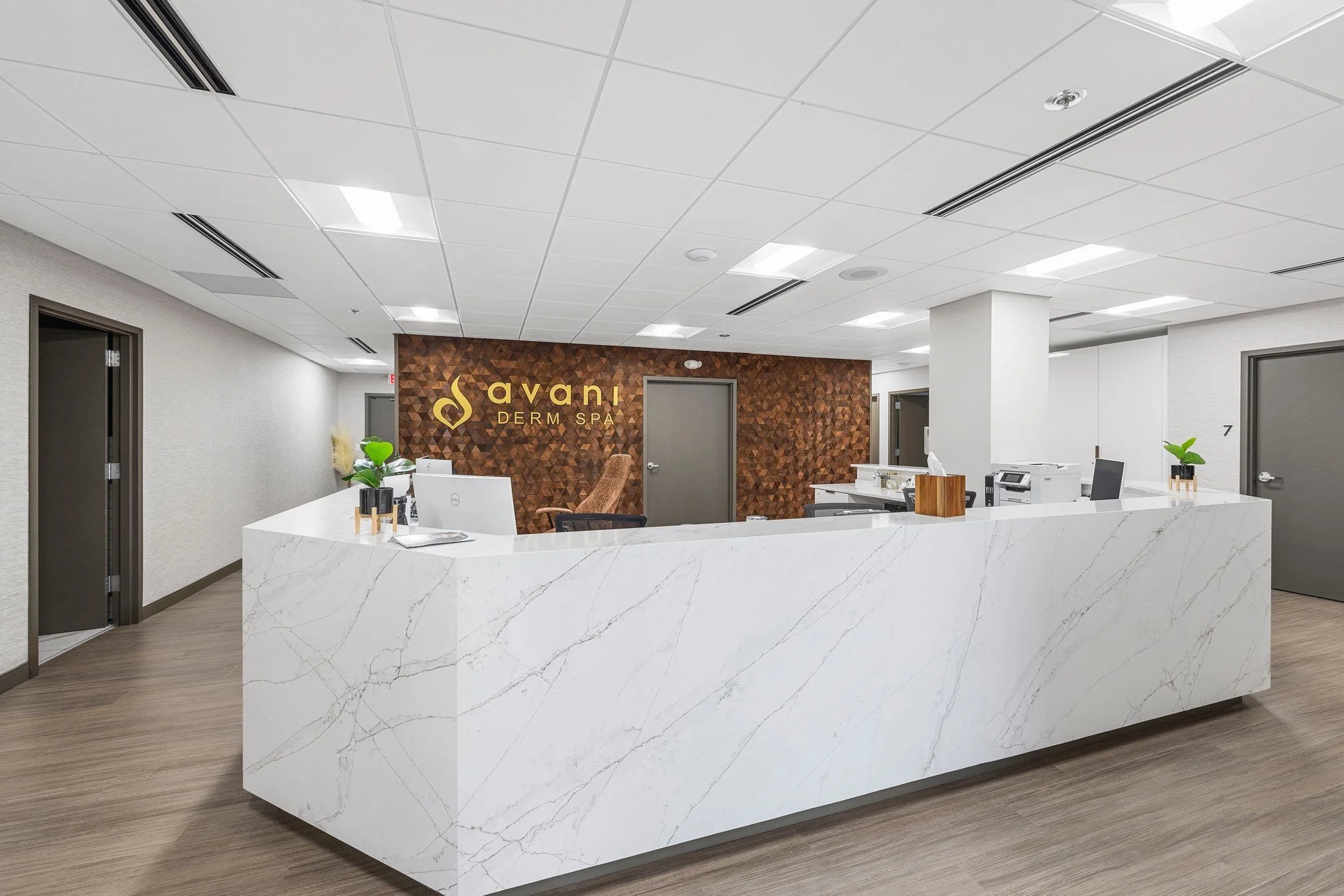 Med spa reception desk with a marble-look finish