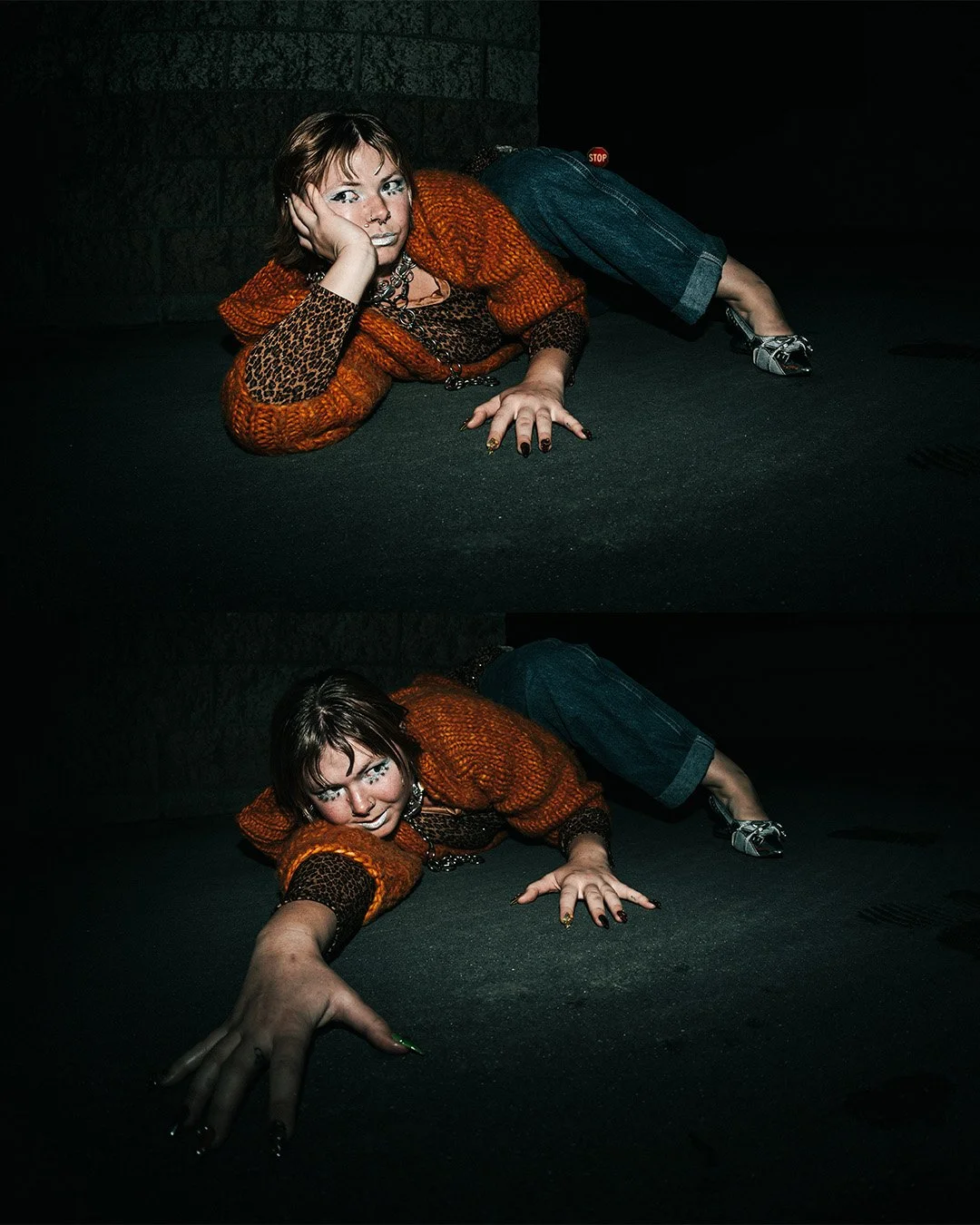 dramatic low angle shot of model reaching forward on the ground, editorial fashion photography with flash