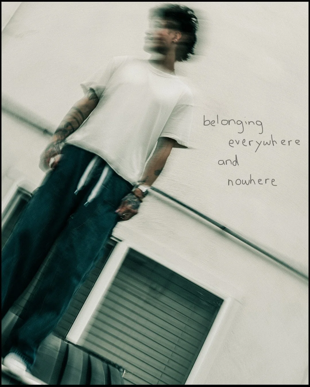 blurred motion portrait of standing figure against a wall, experimental editorial photography with soft green tones