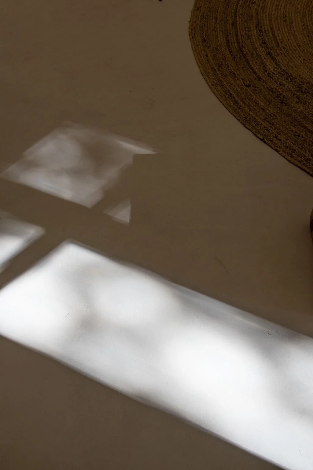 shadow cast on the floor of the window reflection