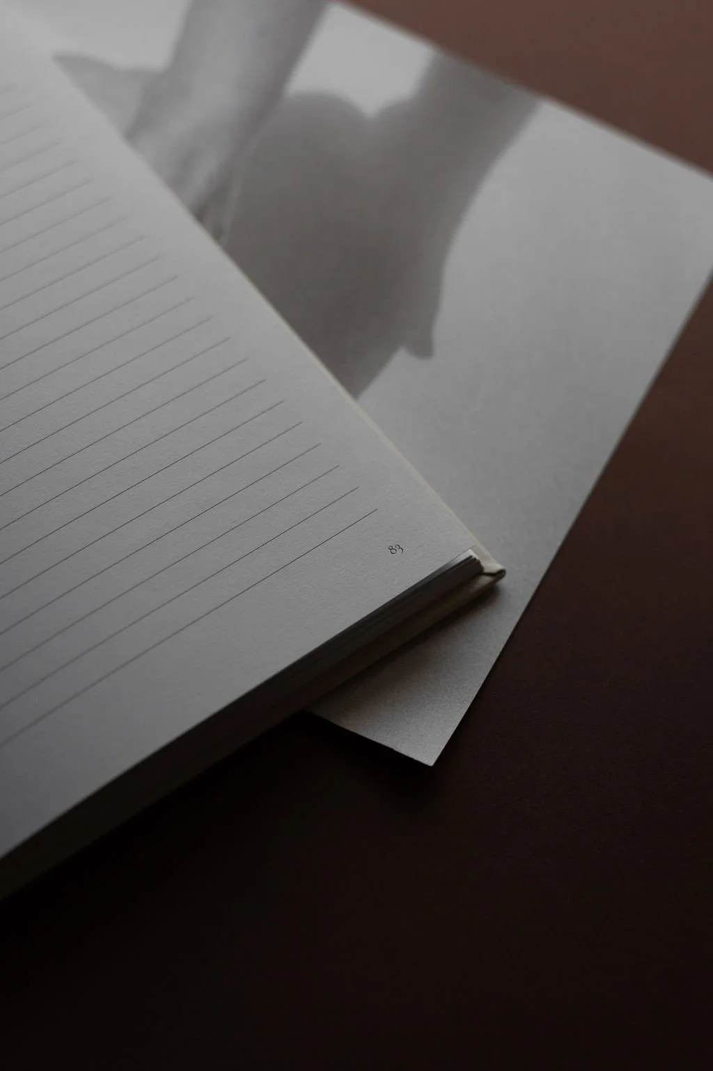 close up of a stack of notebook and paper on a table