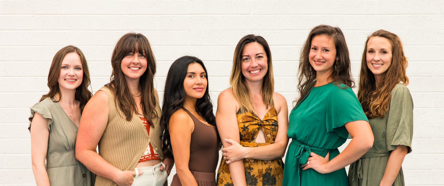 always growing team member group photo with six team members