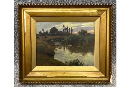 ALADAR EDVI ILLES (1870-1958), AN EARLY 20TH CENTURY OIL ON BOARD, RIVERSCAPE, SIGNED, IN A GILT