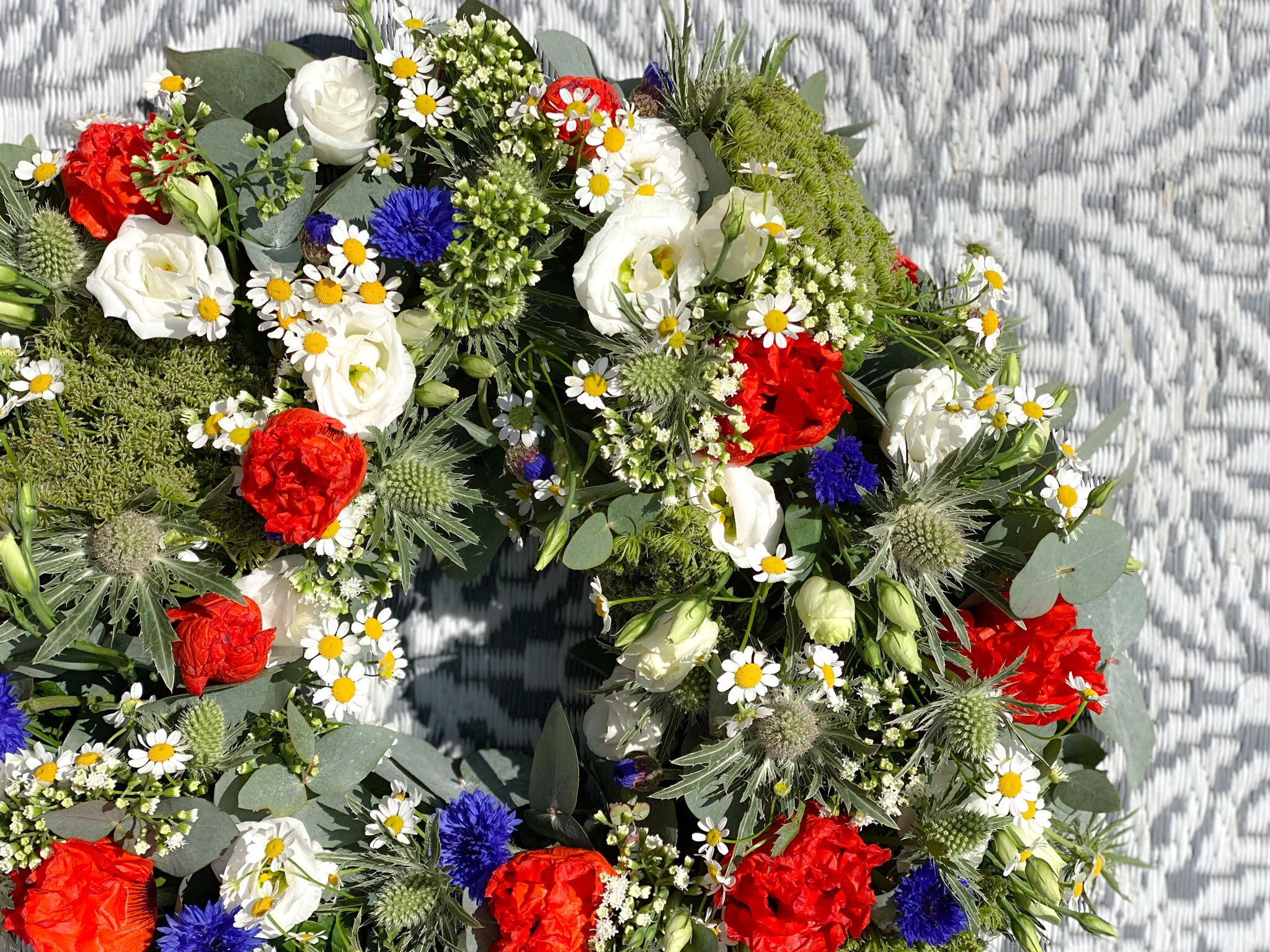 Poppy filled funeral wreath