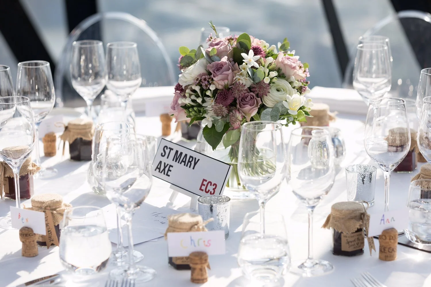 Wedding floristry in London and West Sussex, showcasing ceremony arrangements and table flowers designed to complement modern venues.