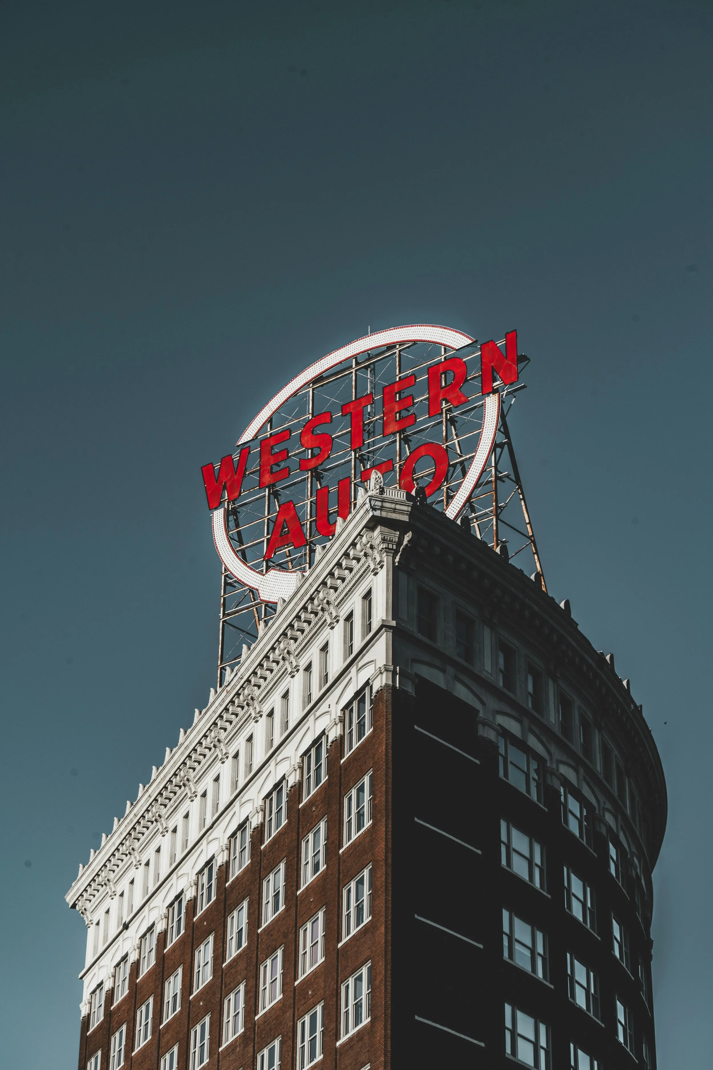 A shot from below of the iconic Kansas City Western Auto sign.