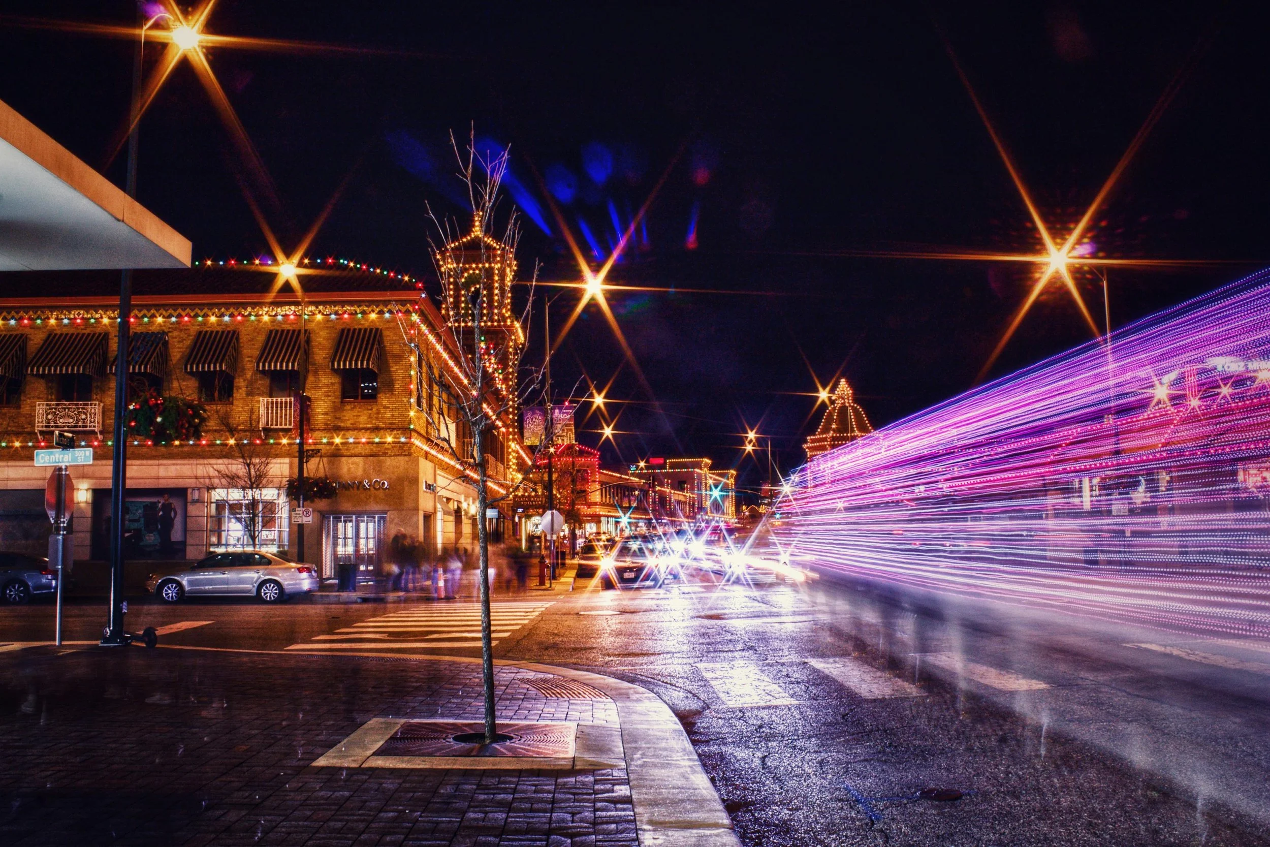 A long exposure photo of the Kansas City Plaza District. During holiday time with the decorative lights.