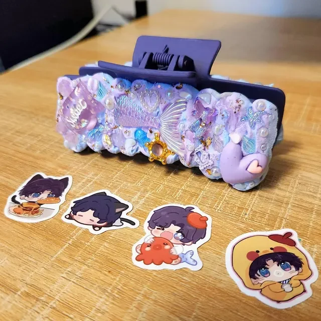 large purple hair claw with stickers