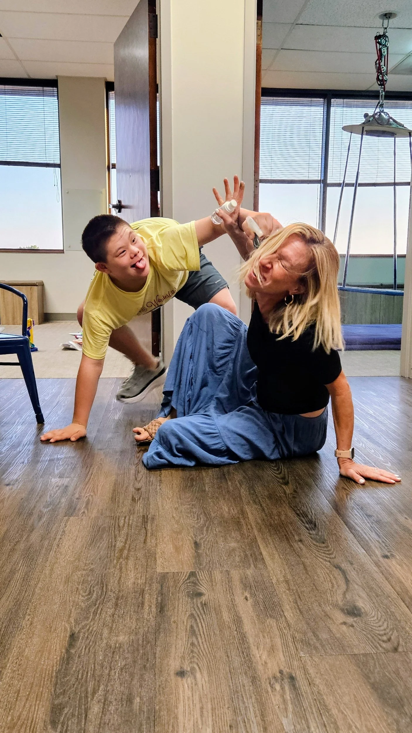 A high school boy is joking with a team member.