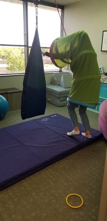 A therapist is inside of a tunnel walking around