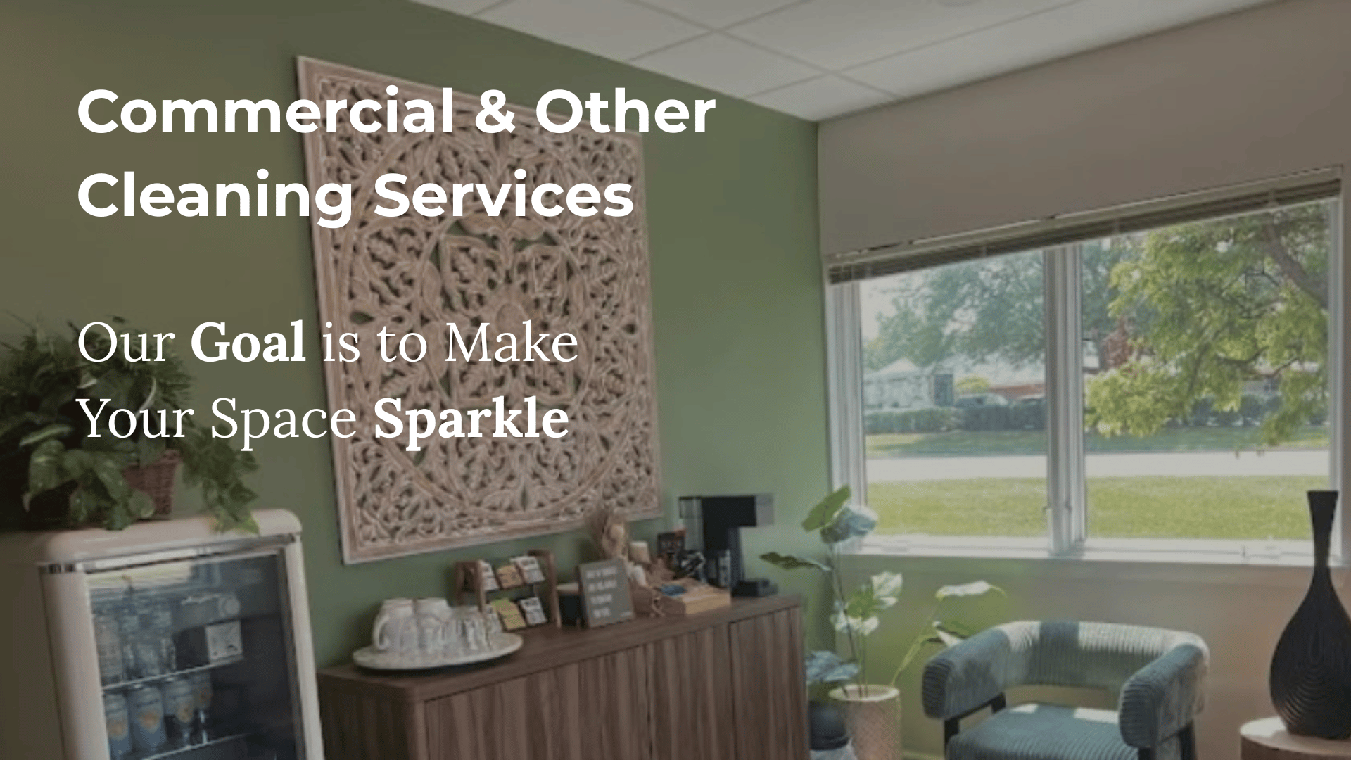 Interior of a cleaning service company's office with a green wall, large window, plants, and furniture, overlaid with promotional text