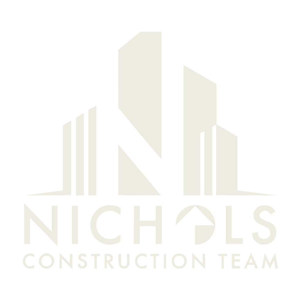 Logo of Nichols Construction Team featuring stylized building structures and the company name.